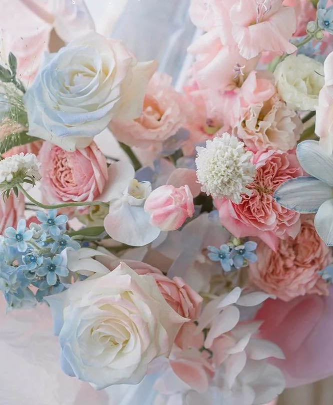 A bouquet of soft blue and pink flowers